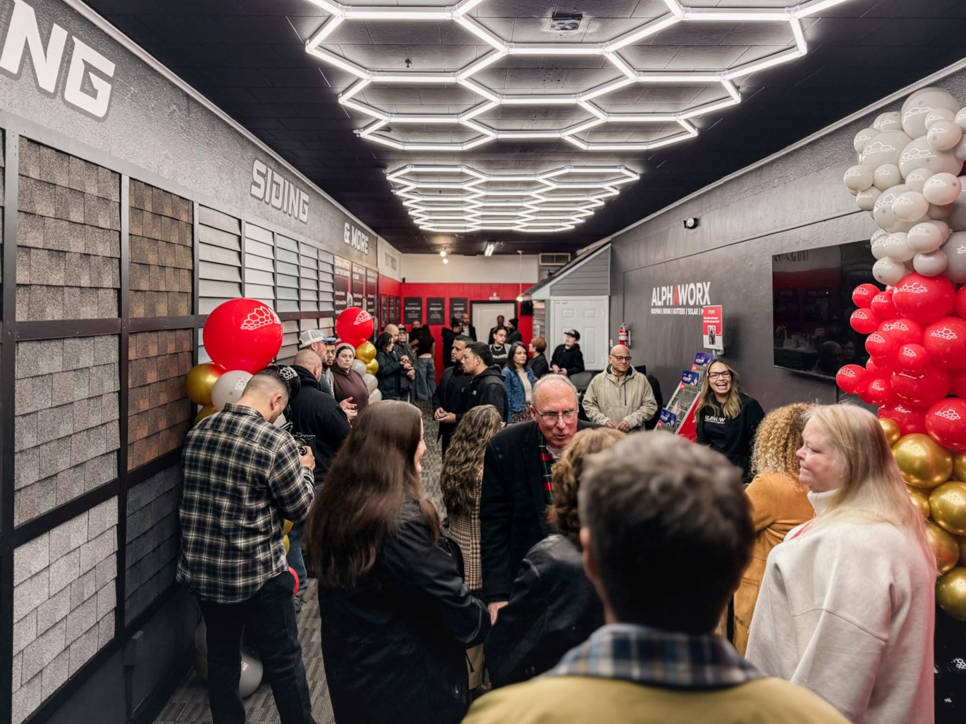 CBNA members and guests networking at the Alphaworx ribbon cutting