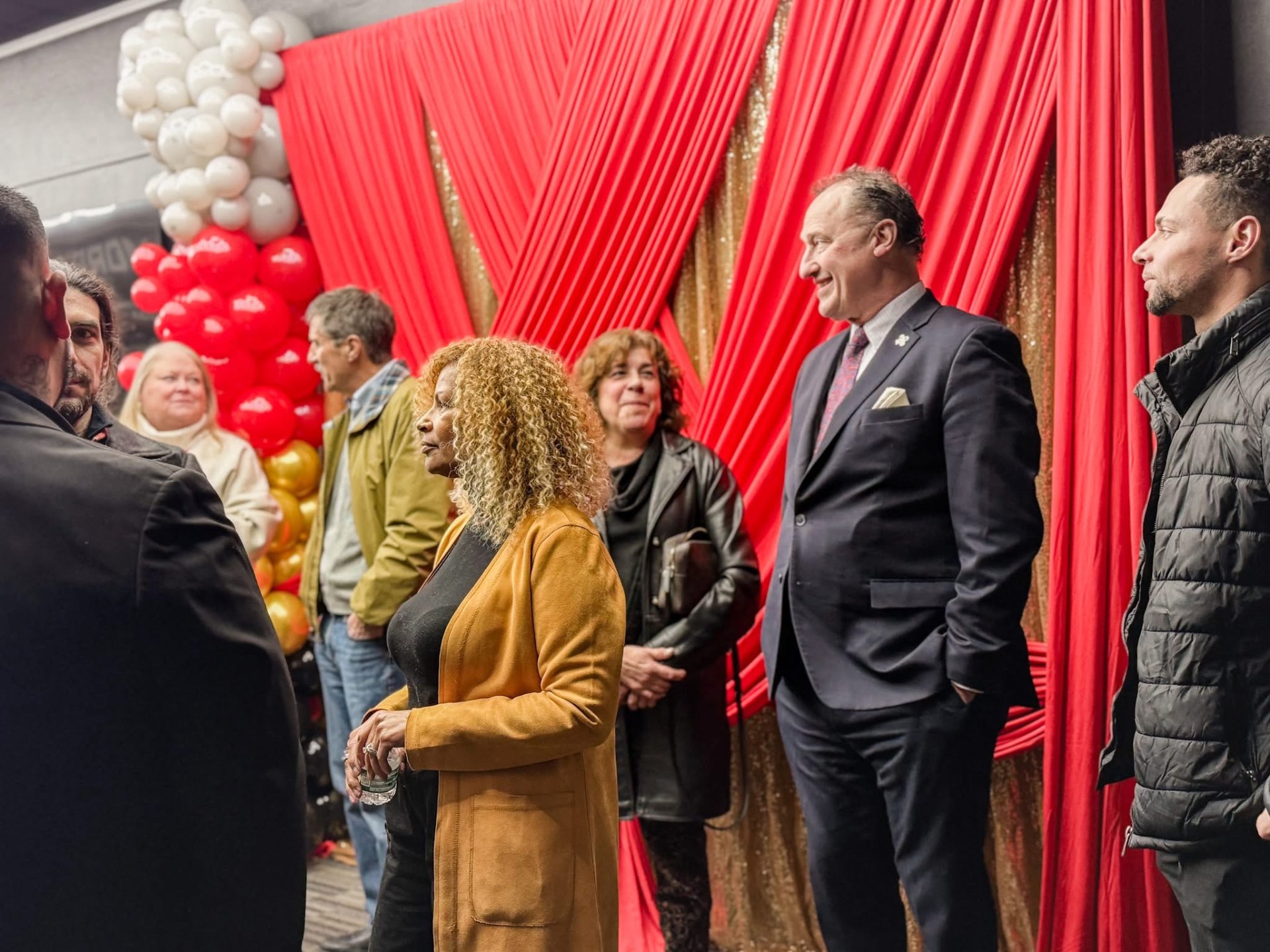 Guests mingling and celebrating at the Alphaworx event